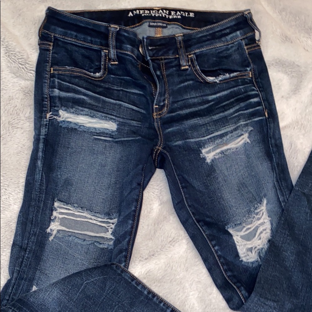 two pairs of american eagle skinny jeans